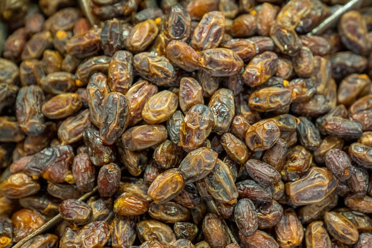 A close-up of organic dried dates showcasing their natural texture and rich color, perfect for healthy snacking.